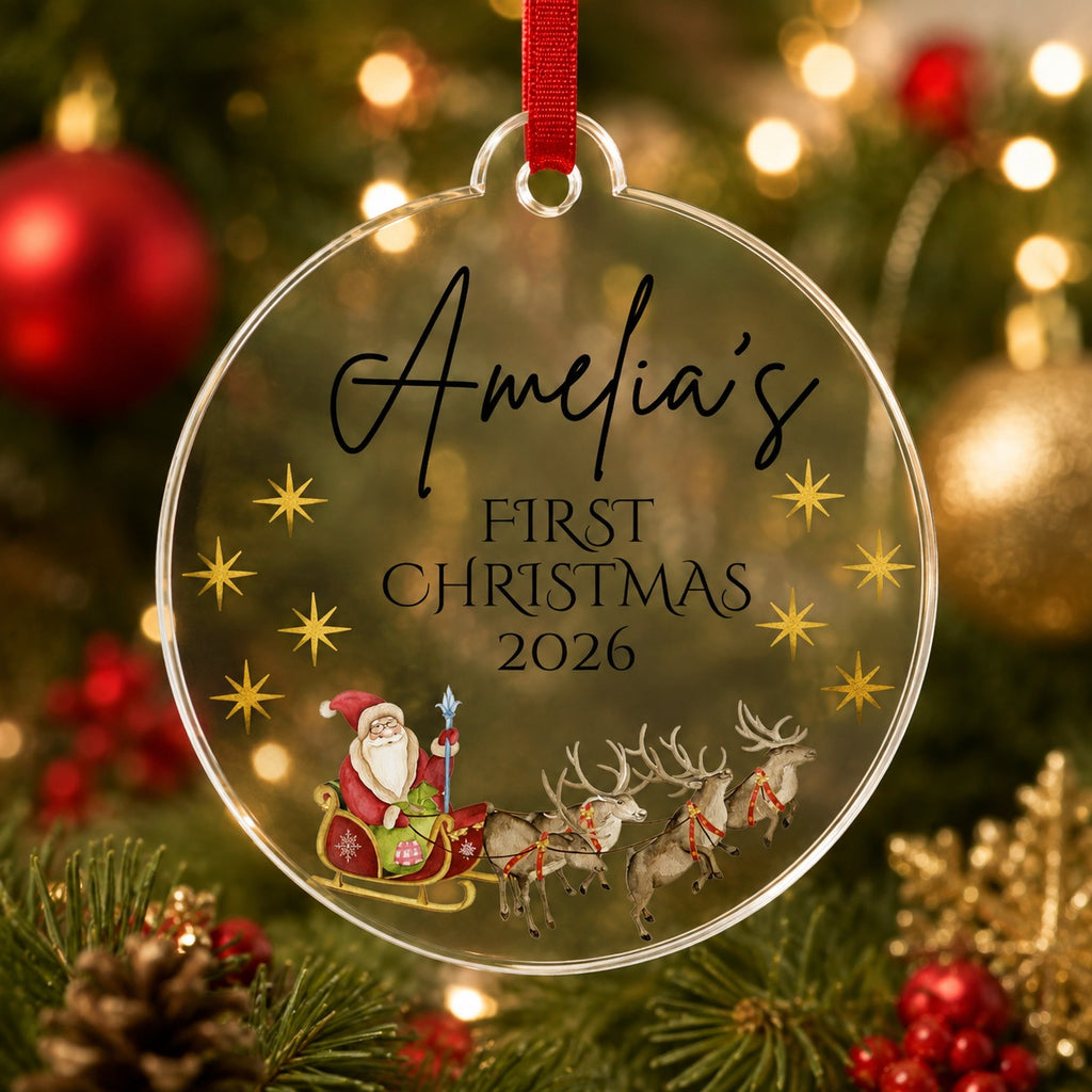 Personalised first Christmas Santa sleigh bauble with name Amelia and year 2026 on clear acrylic