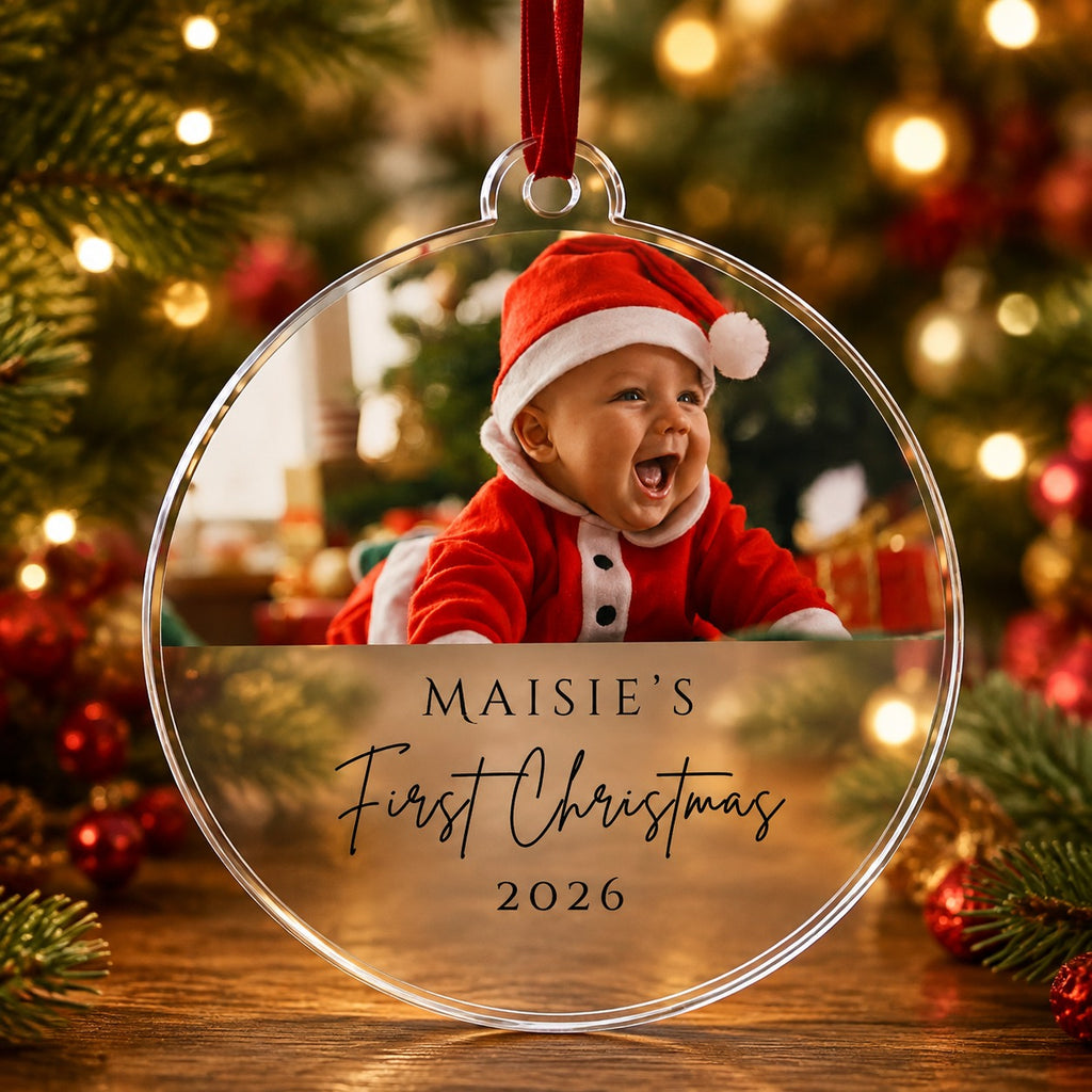 Personalised baby's first Christmas photo bauble with baby photo, name Maisie and year 2026