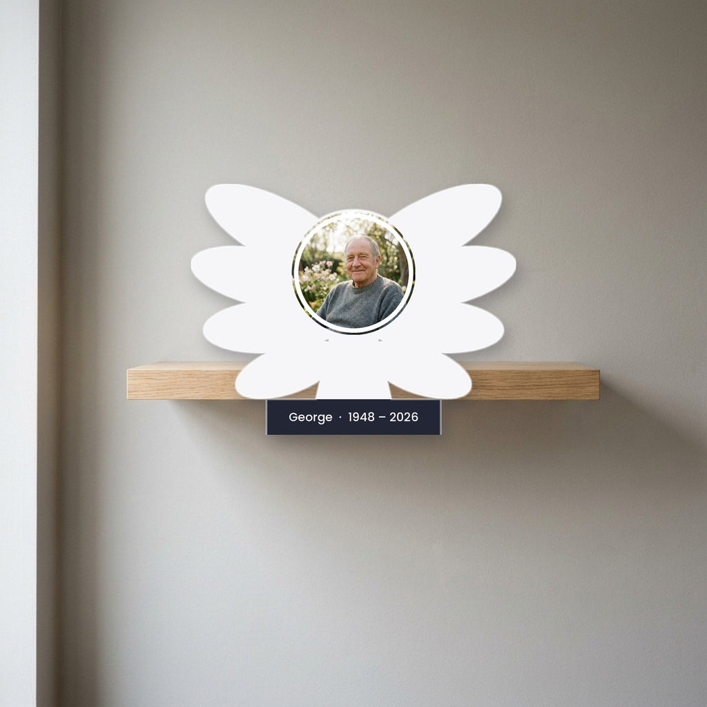 Angel wings memorial block displayed on a shelf