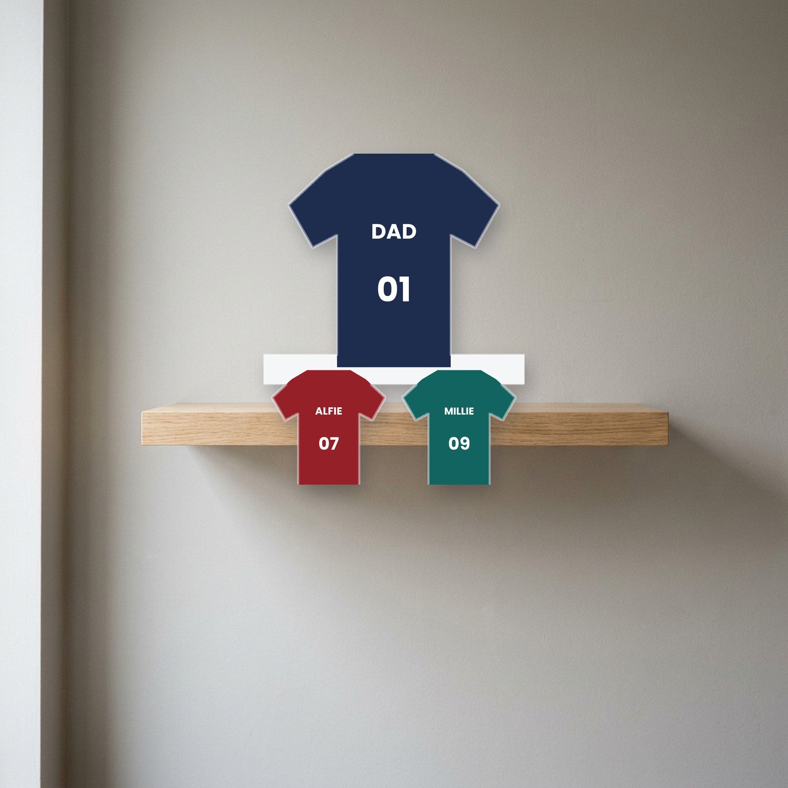 Football shirts photo block displayed on a shelf