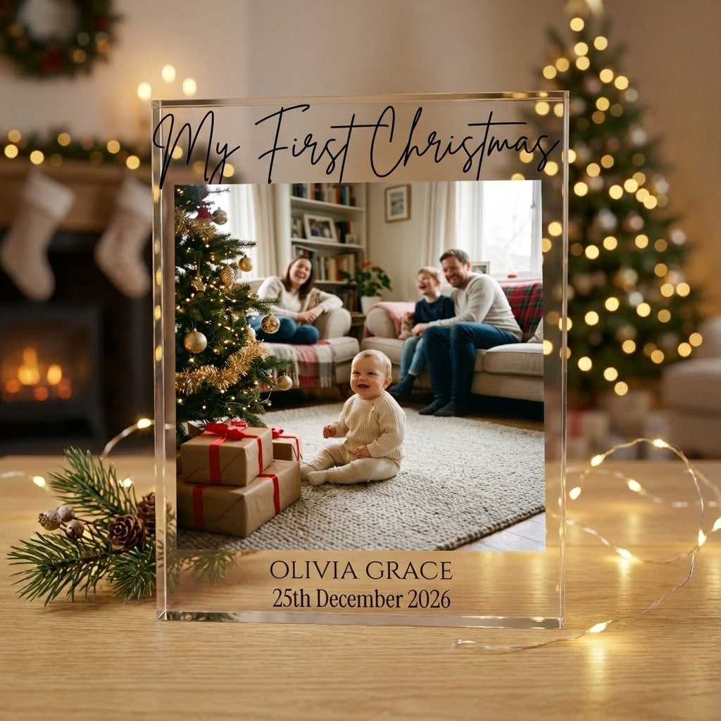 Baby's First Christmas acrylic photo block displayed in a festive home setting