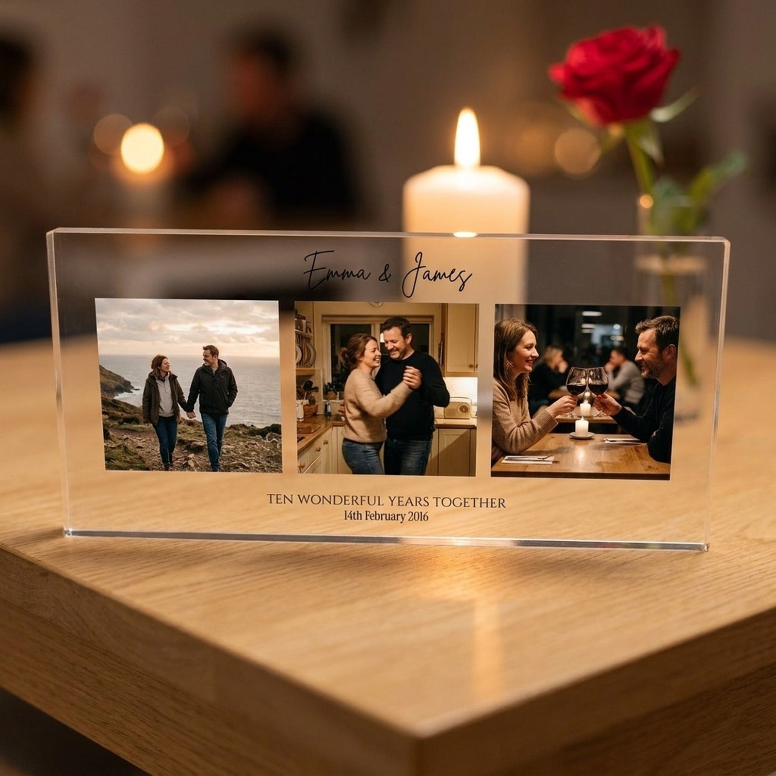 Anniversary photo collage acrylic block displayed on a table with candle and rose