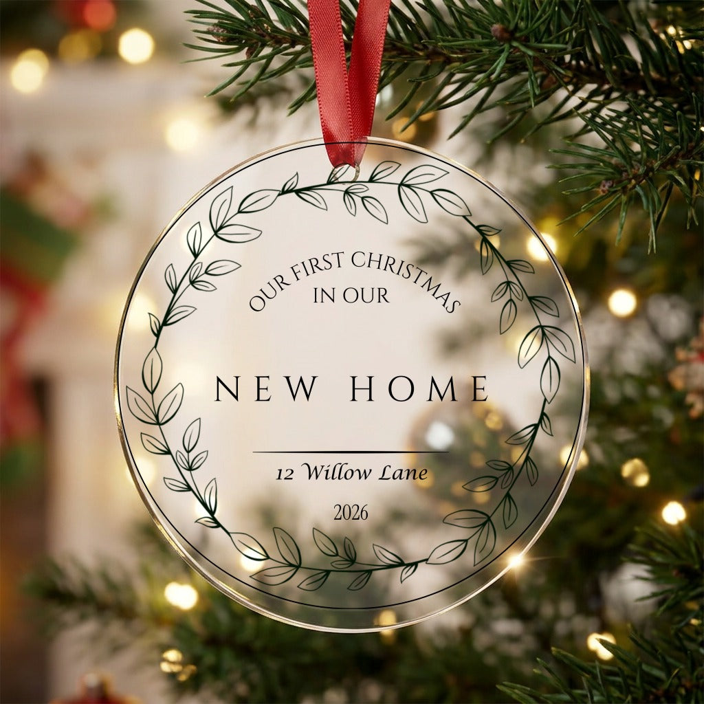Personalised first Christmas in our new home acrylic bauble with address and year hanging on a Christmas tree