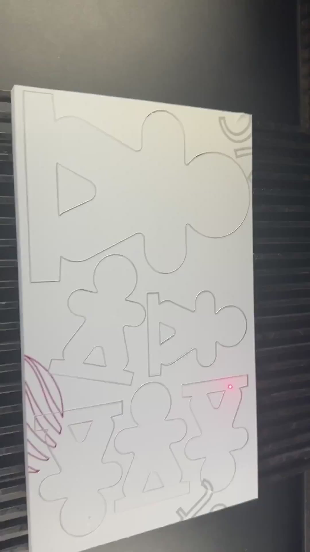 Personalised acrylic gingerbread place names being made